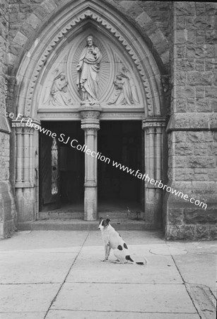 DOG OUTSIDE CHURCH DOOR